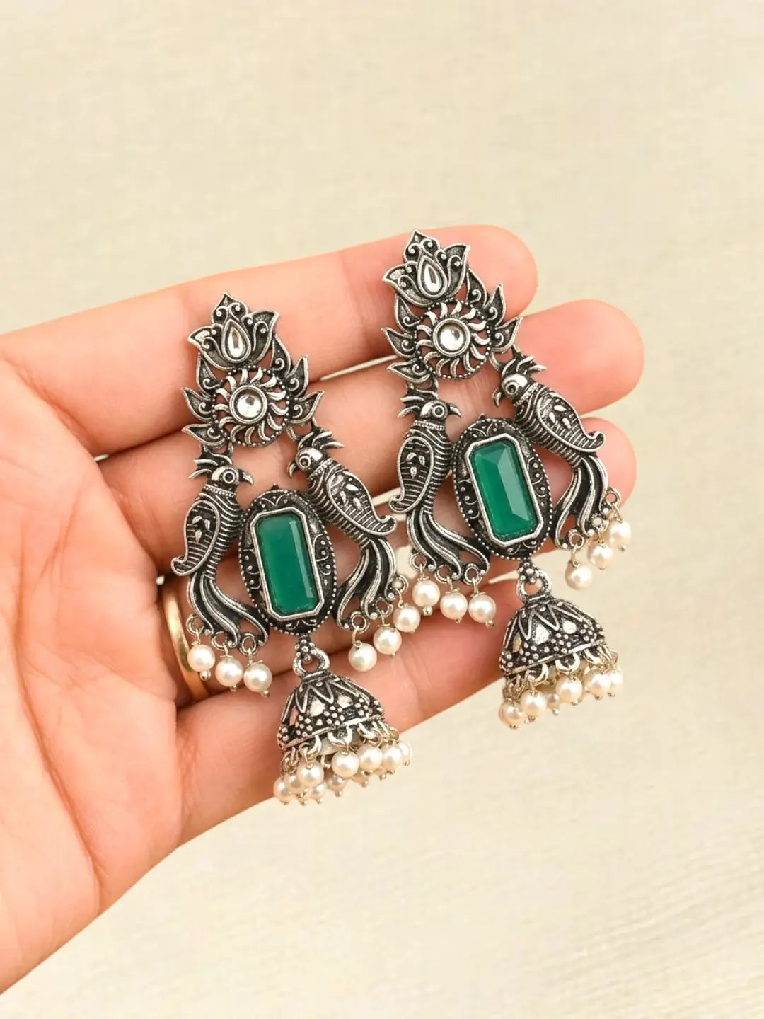 Silver Oxidised Peacock Motif Green Jhumka Earrings